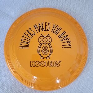 Hooters Makes You Happy Orange Frisbee